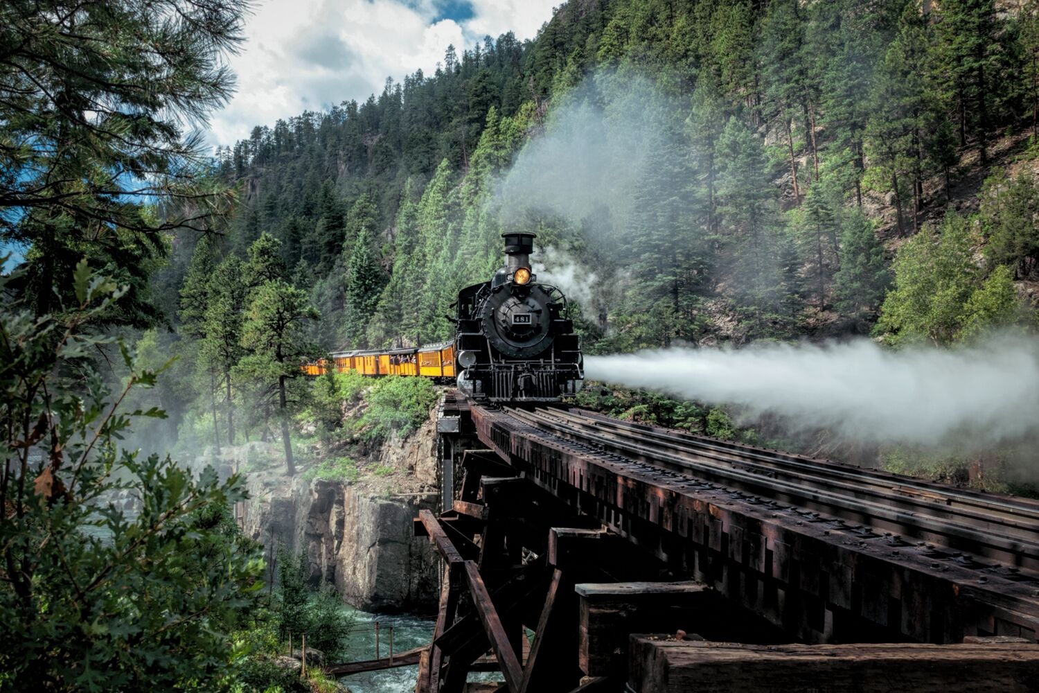 First train to Silverton Colorado crosses the High Bridge with a full train of passengers enjoying there ride on the Durango...