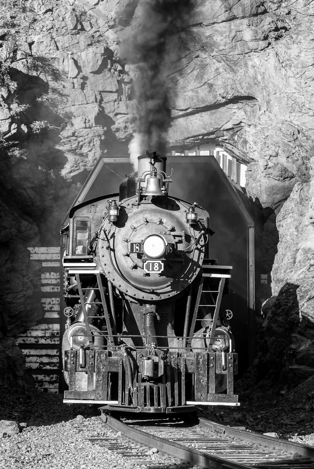 There's always daylight at the end of the tunnel. Rio Grande Scenic Railway steam locomotive number 18 finds daylight at on of...