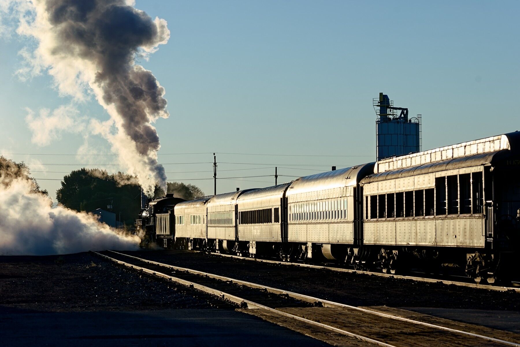 Departing Alamosa A golden morning sunrise reflects off the passenger cars as this Rio Grande Scenic passenger train departs Alamosa Colorado.