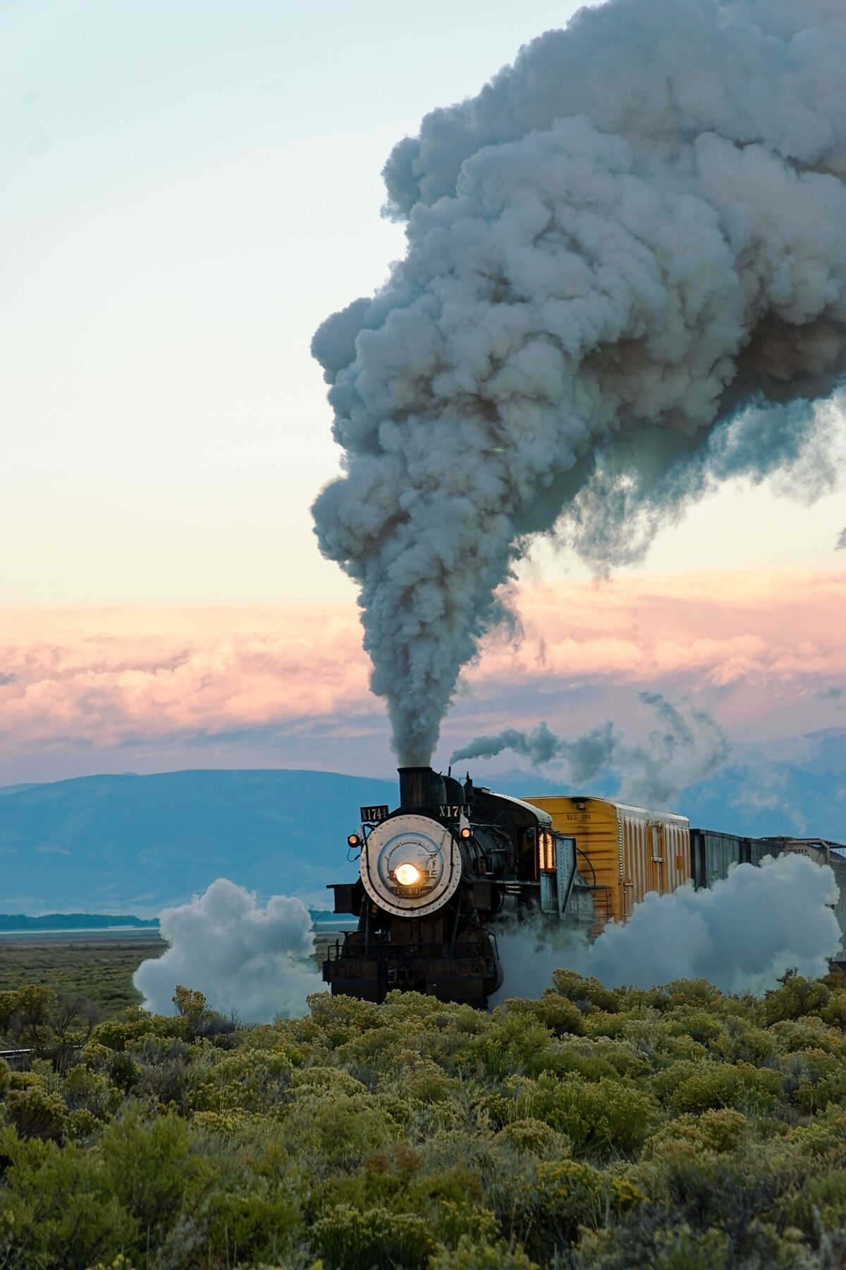 On The Move At Sunrise On the move and heading east at sunrise outside of Alamosa Colorado on the Rio Grande Scenic Railroad.
