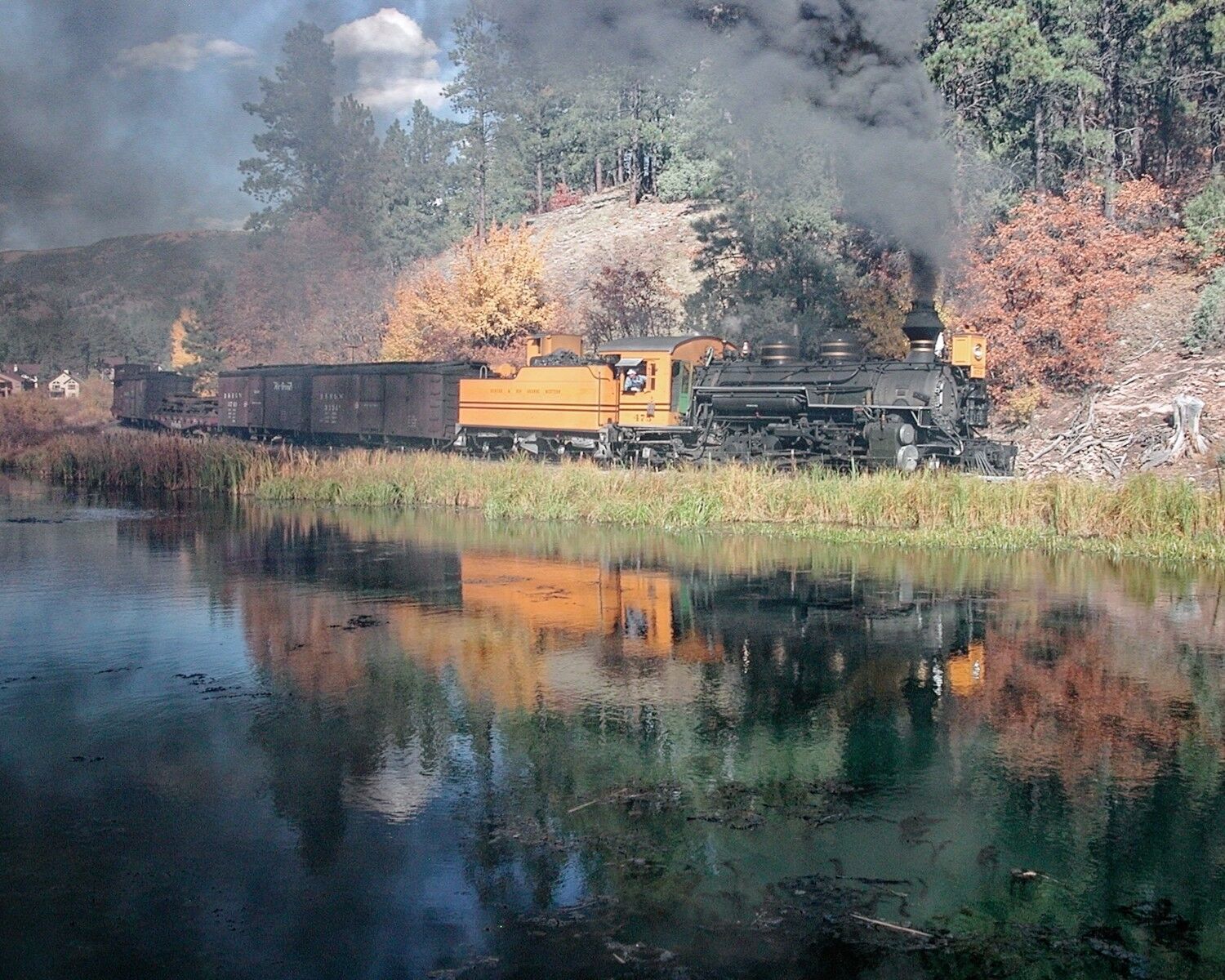 Reflection At Rockwood A nice hard working narrow gauge freight reflects on the lake at Rockwood Colorado.