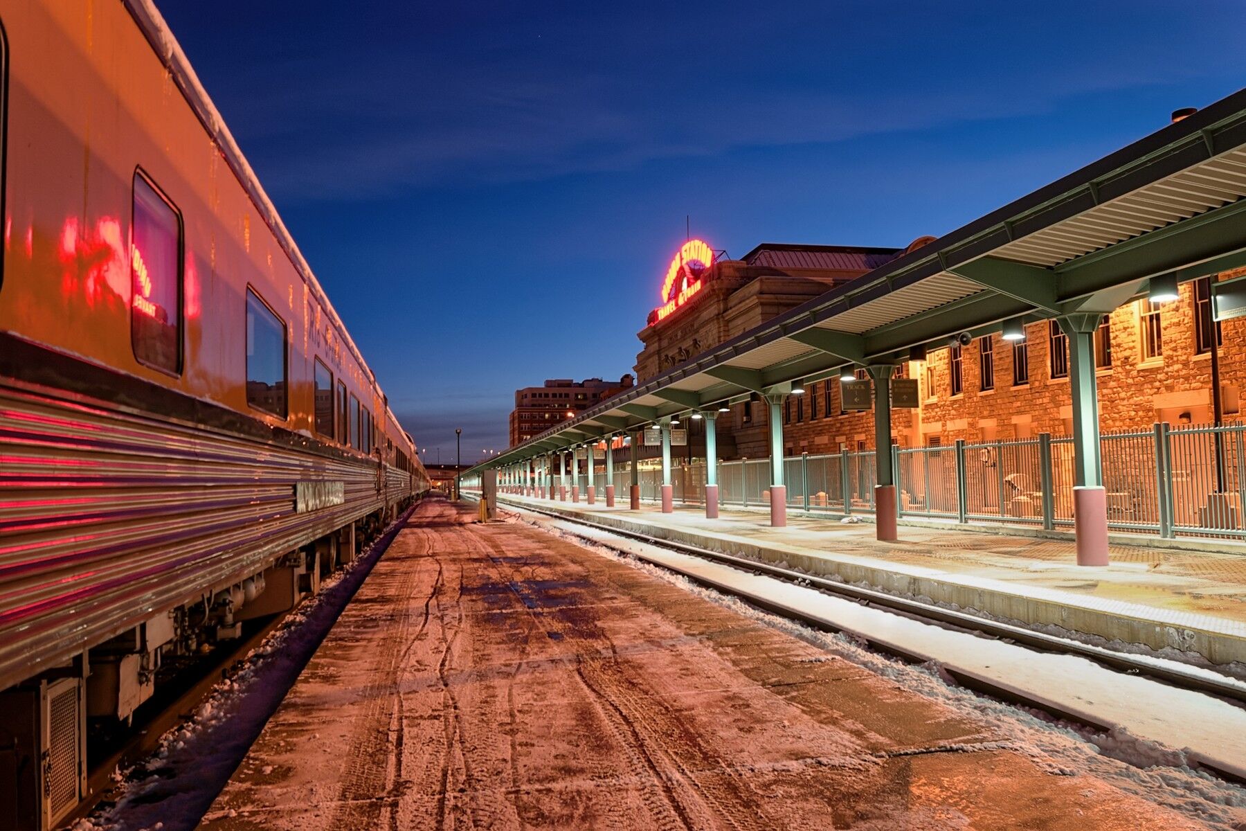 Reflection Of The Ski Train It's a cold morning at Denver's Union Station with the ski trains reflection this morning.