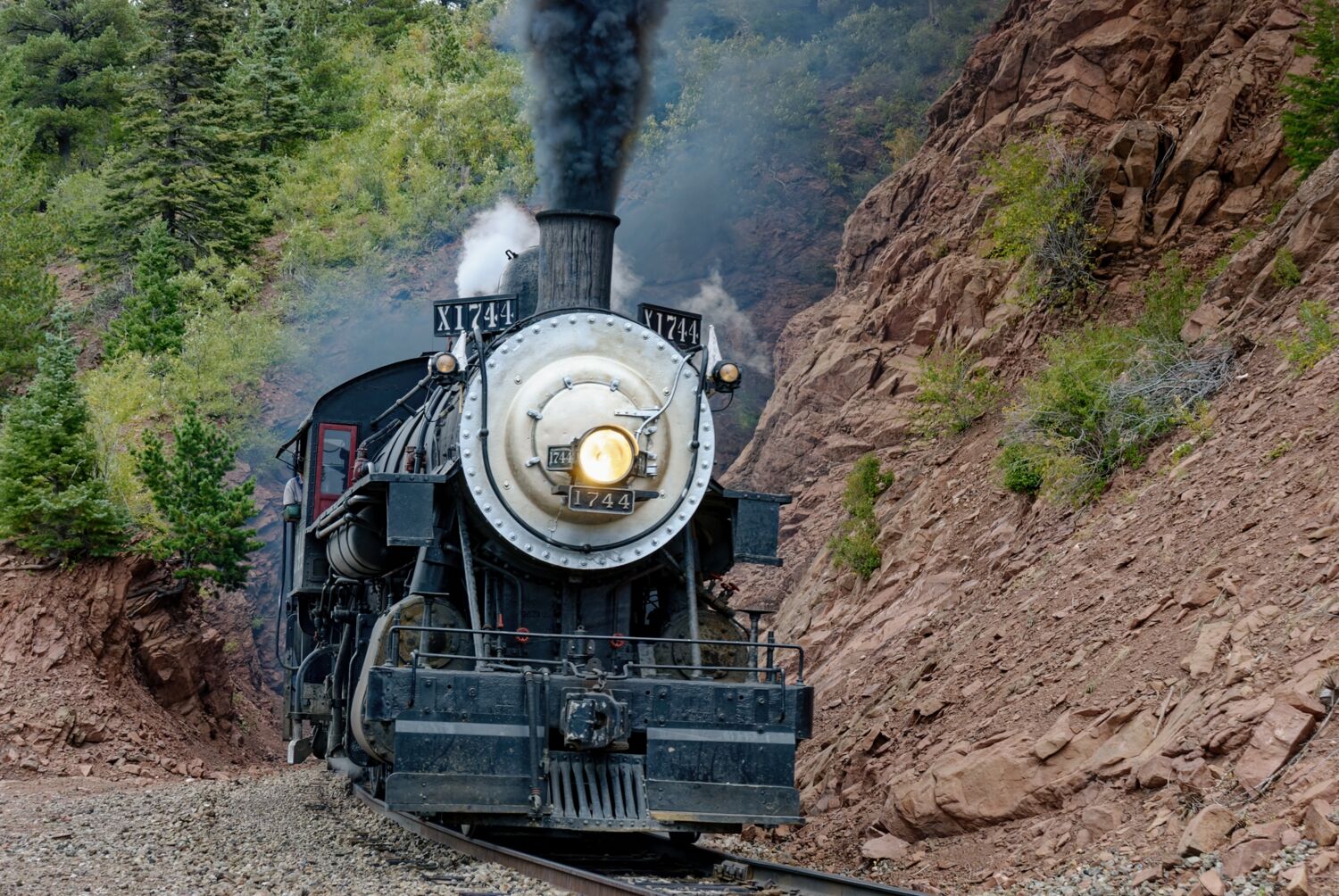 1744 finally sees some daylight at one of the tunnels on the Rio Grande Scenic Railroad in Colorado.
