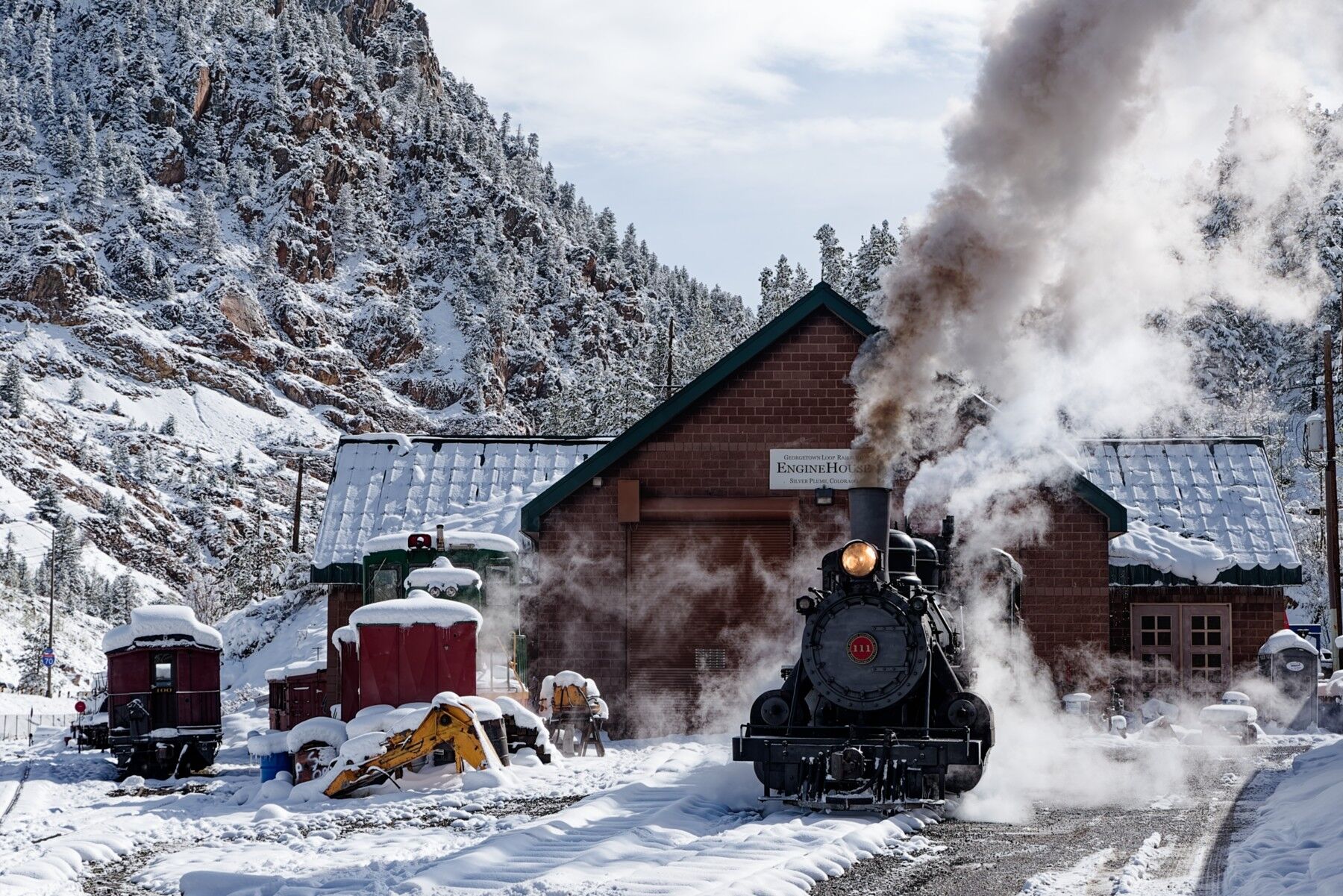 111 sitting at the Silver Plume engine house and a foot of snow from a overnight snow storm blankets the ground making for a...