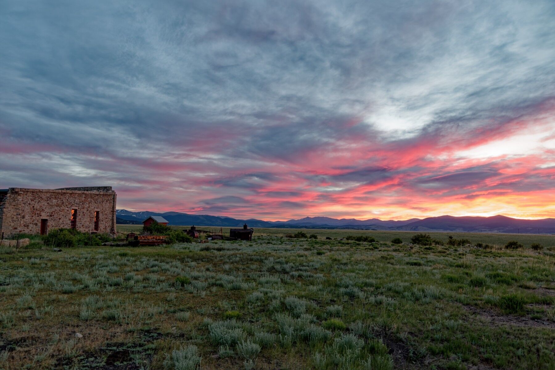 A very colorful sunrise starts to rise over Union Pacific steam engine 844. Steam locomotive number 844 is parked at Denver's...