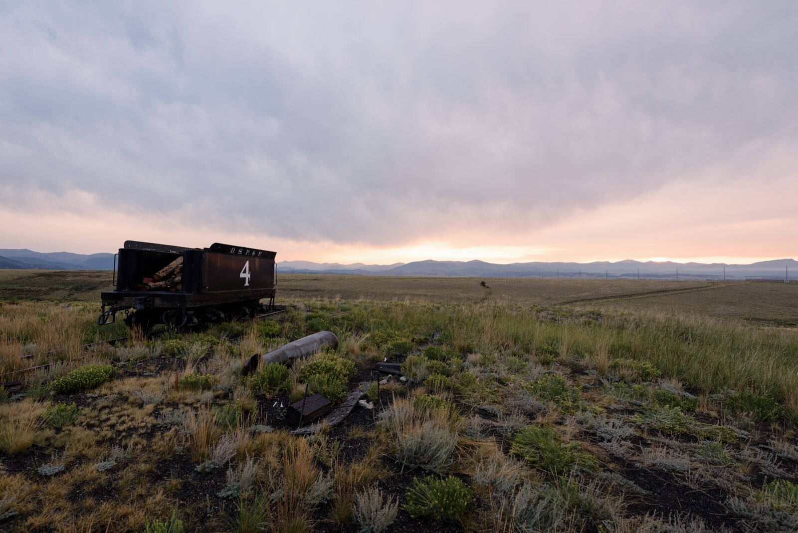 A blue sunrise over a steam locomotive tender at the Como roundhouse in Como Colorado.