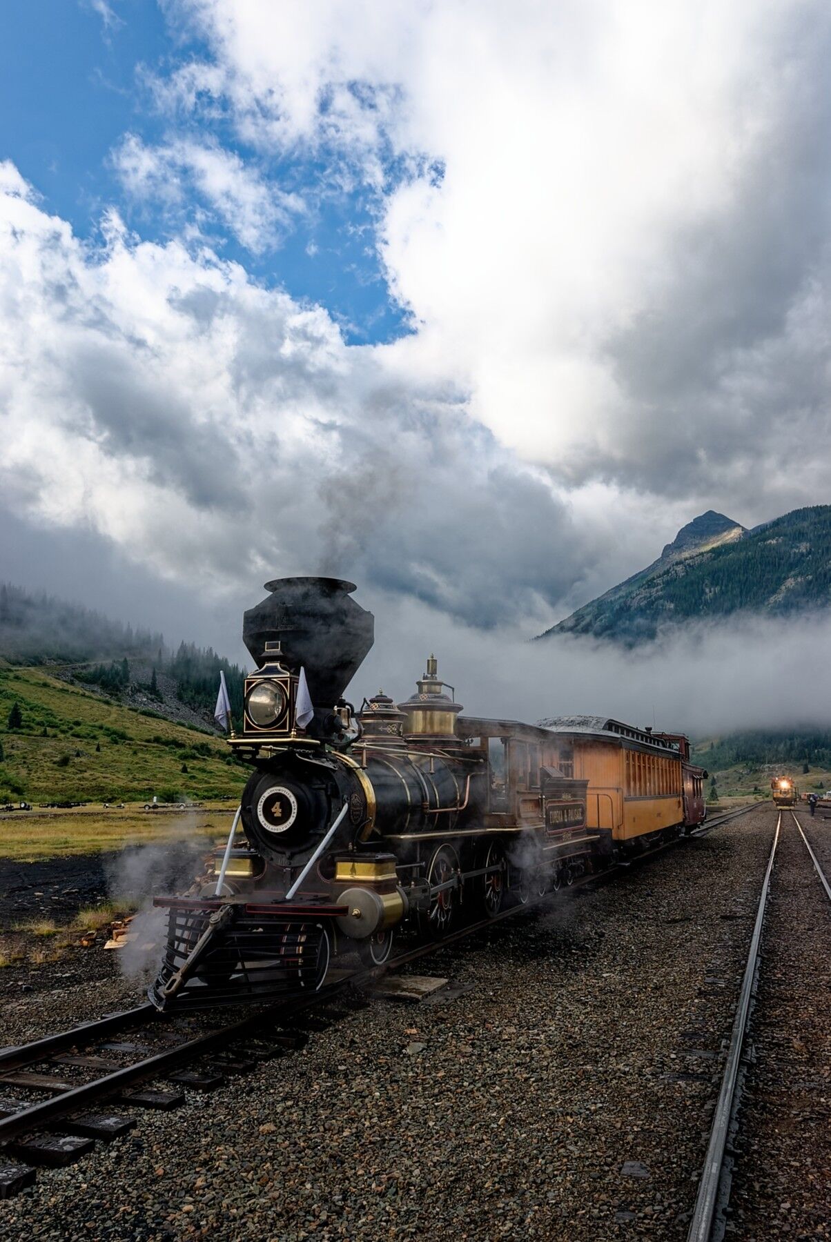 Lifting clouds open  like the heavens above Eureka in Silverton Colorado.