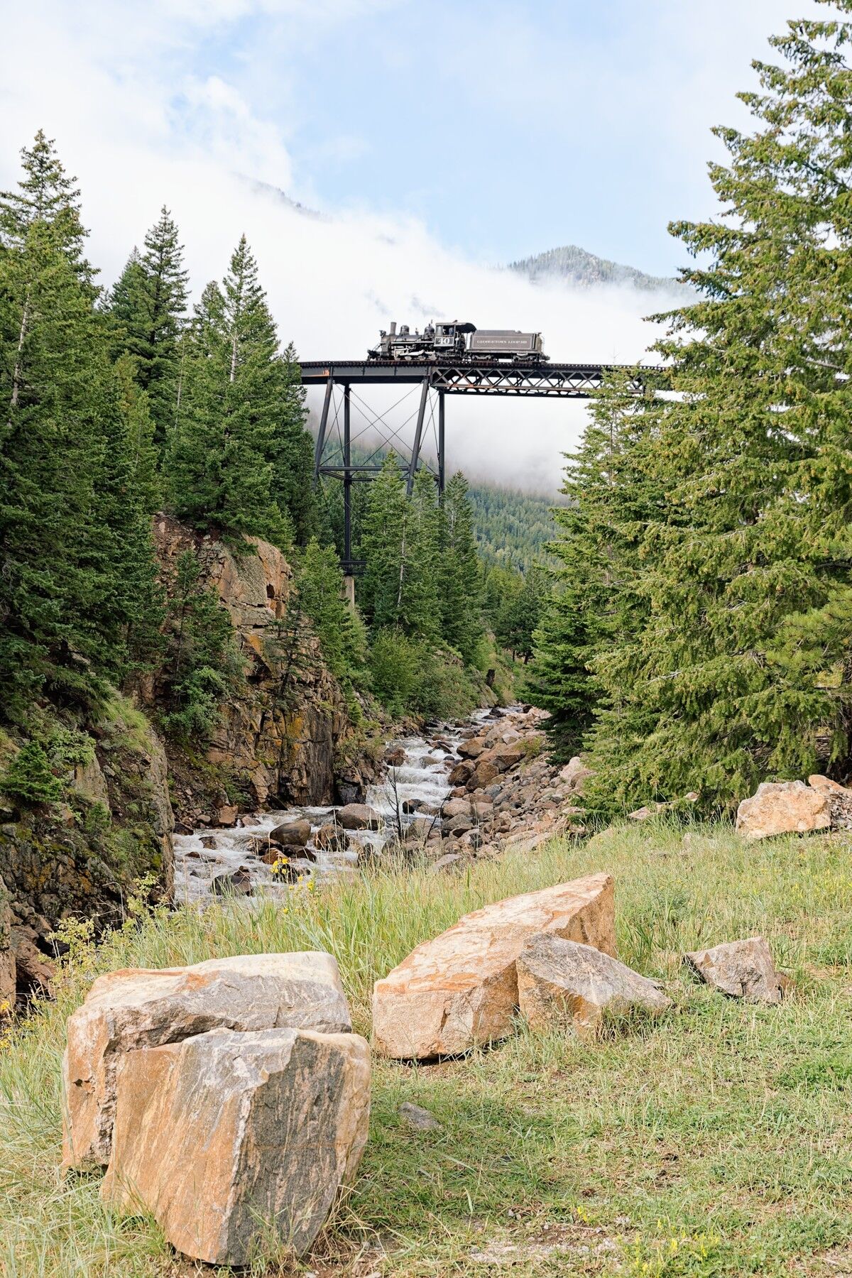 Tiny Engine Up High Georgetown Loop 111 looks very tiny crossing Devils Gate Bridge.