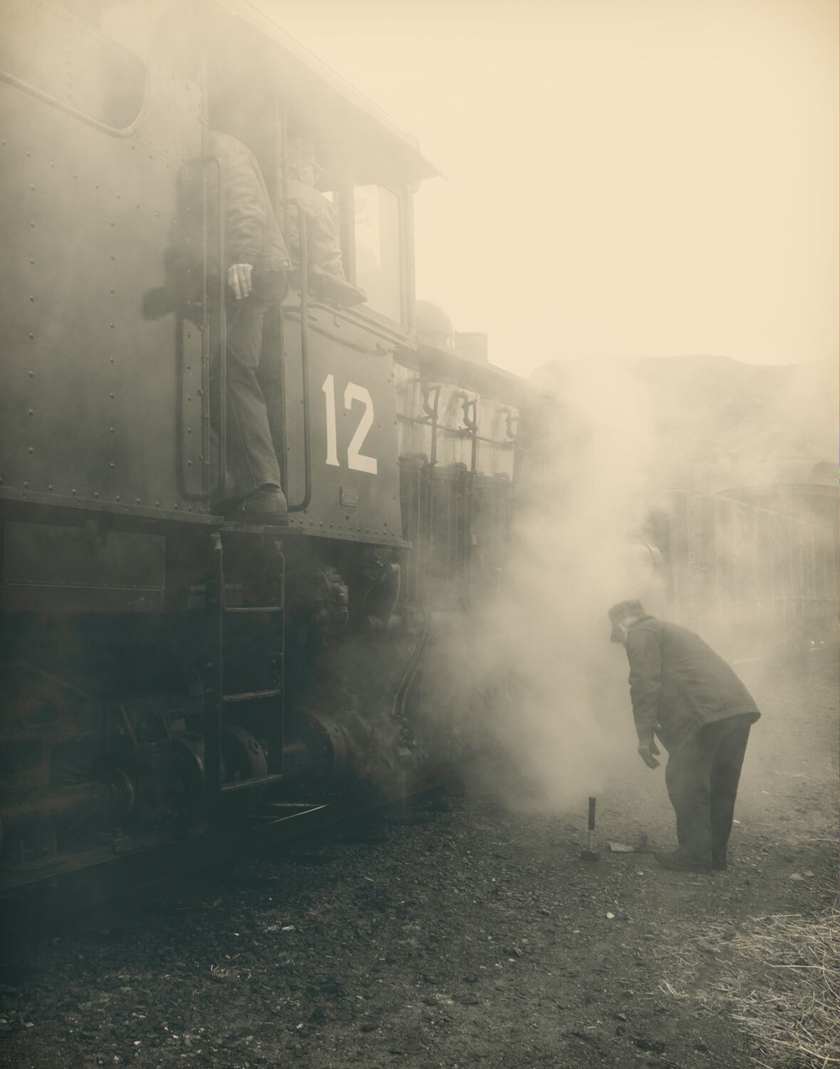 Lots of mood in this photograph of Shay number 12 getting a quick repair from a crew member at the Colorado Railroad Museum in...